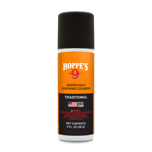 A 2 fl. oz. orange and black can of Hoppe's No. 9 Gun Bore Cleaner with warning label and American flag.