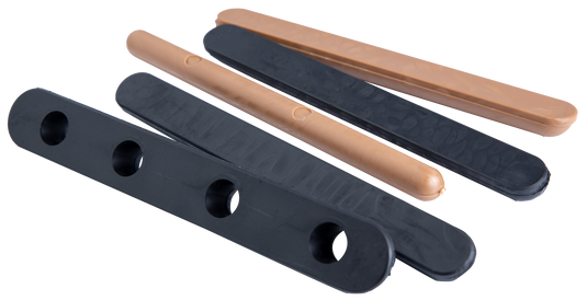 Six Big Bucks Rattling Bags by Primos, in black and tan, three with holes and three solid, on a white surface.