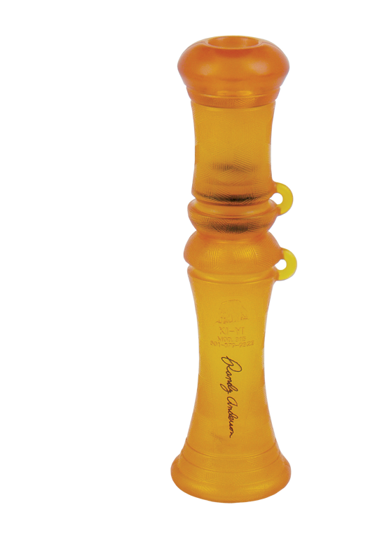 A yellow Primos Lil' Dog Predator Call with ridged texture and signature, isolated on a white background.