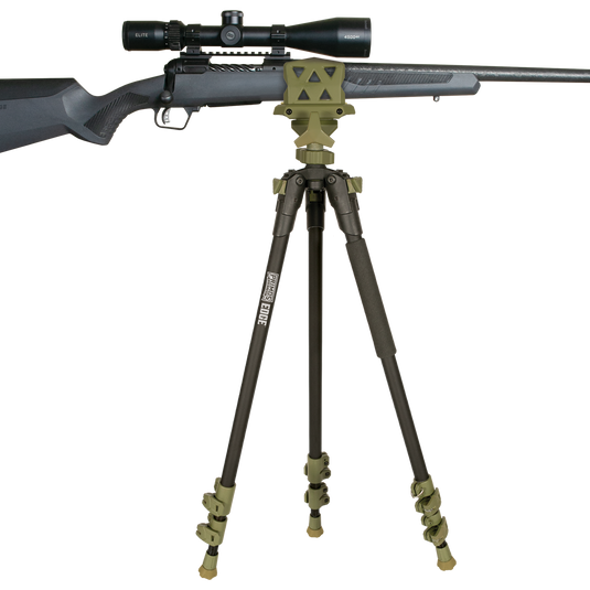 A Primos Edge Aluminum Tripod Shooting Stick with an adjustable gun clamp holds a scoped rifle in place.