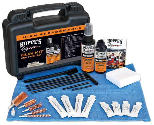 Hoppes Elite gun cleaning kit with various components on a blue towel