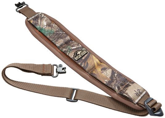 Butler Creek Comfort Stretch Firearm Sling features padded camo design, adjustable brown strap, and metal swivels.
