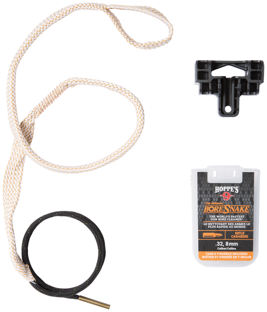 Gun cleaning kit unpacked, showing rope, brush, and Hoppe's gun bore cleaner on a white background