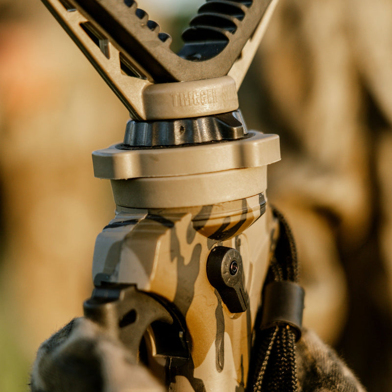 Load image into Gallery viewer, Close-up of a tactical tripod with camouflage design on a blurred natural background
