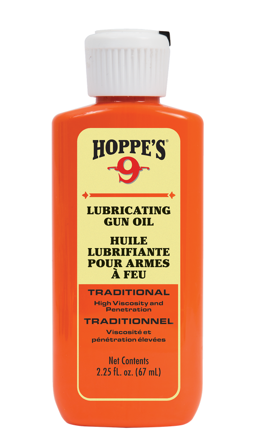 A bottle of Hoppe's Lubricating Oil for firearms, with red cap and yellow-orange bilingual label.