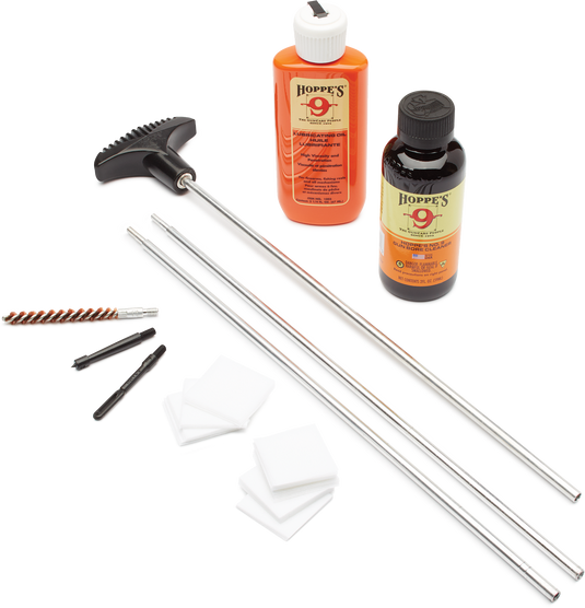 Gun cleaning kit with Hoppe's lubricant bottles, rods, and brushes on a white background