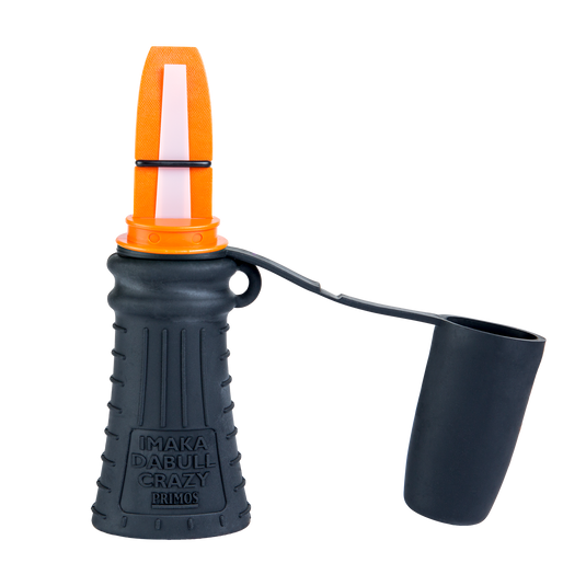 A black and orange Primos Imaka Da Bull Crazy Close Range Elk Call with cap, labeled on the side.