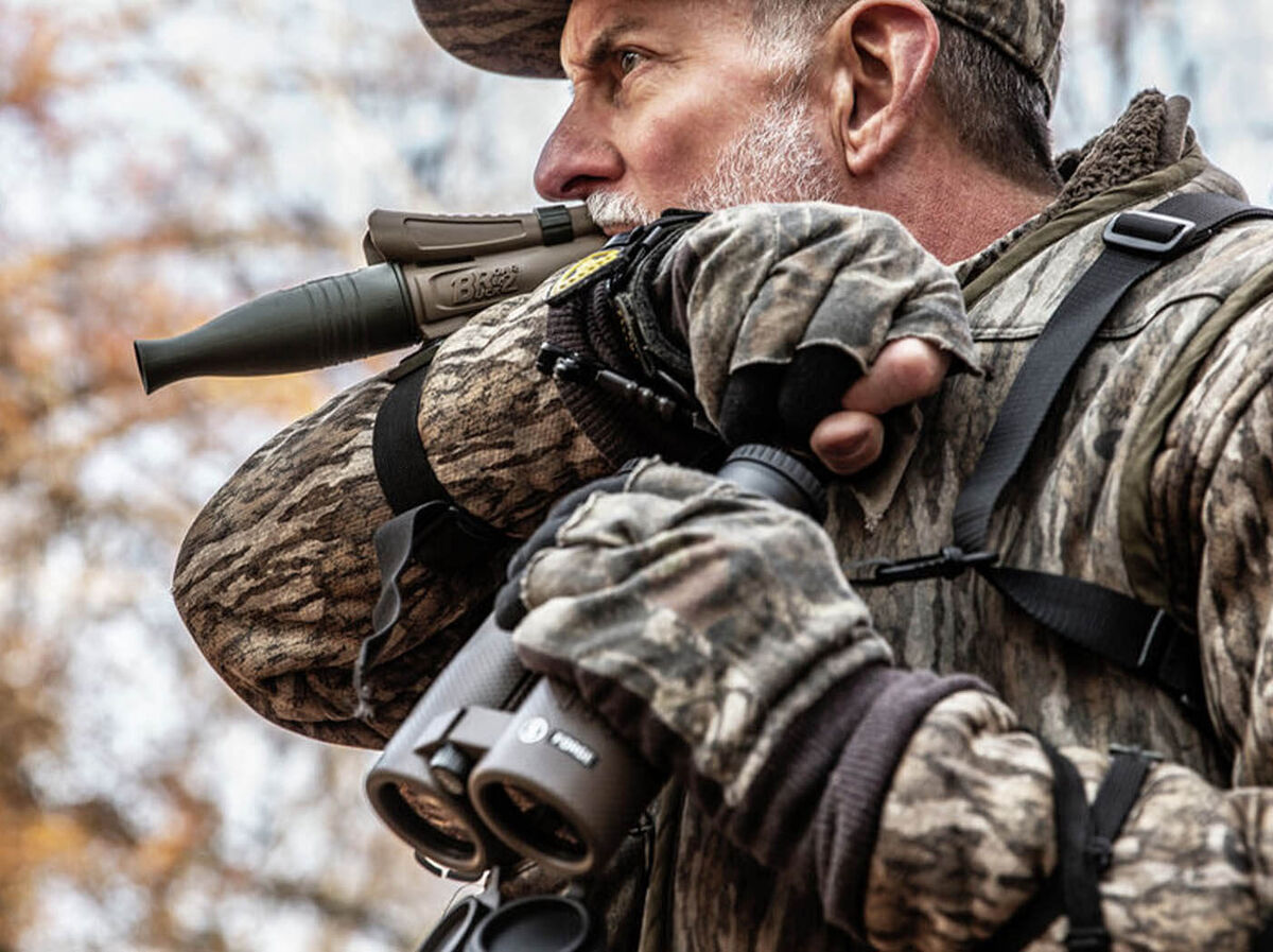 Hunter calling in camo